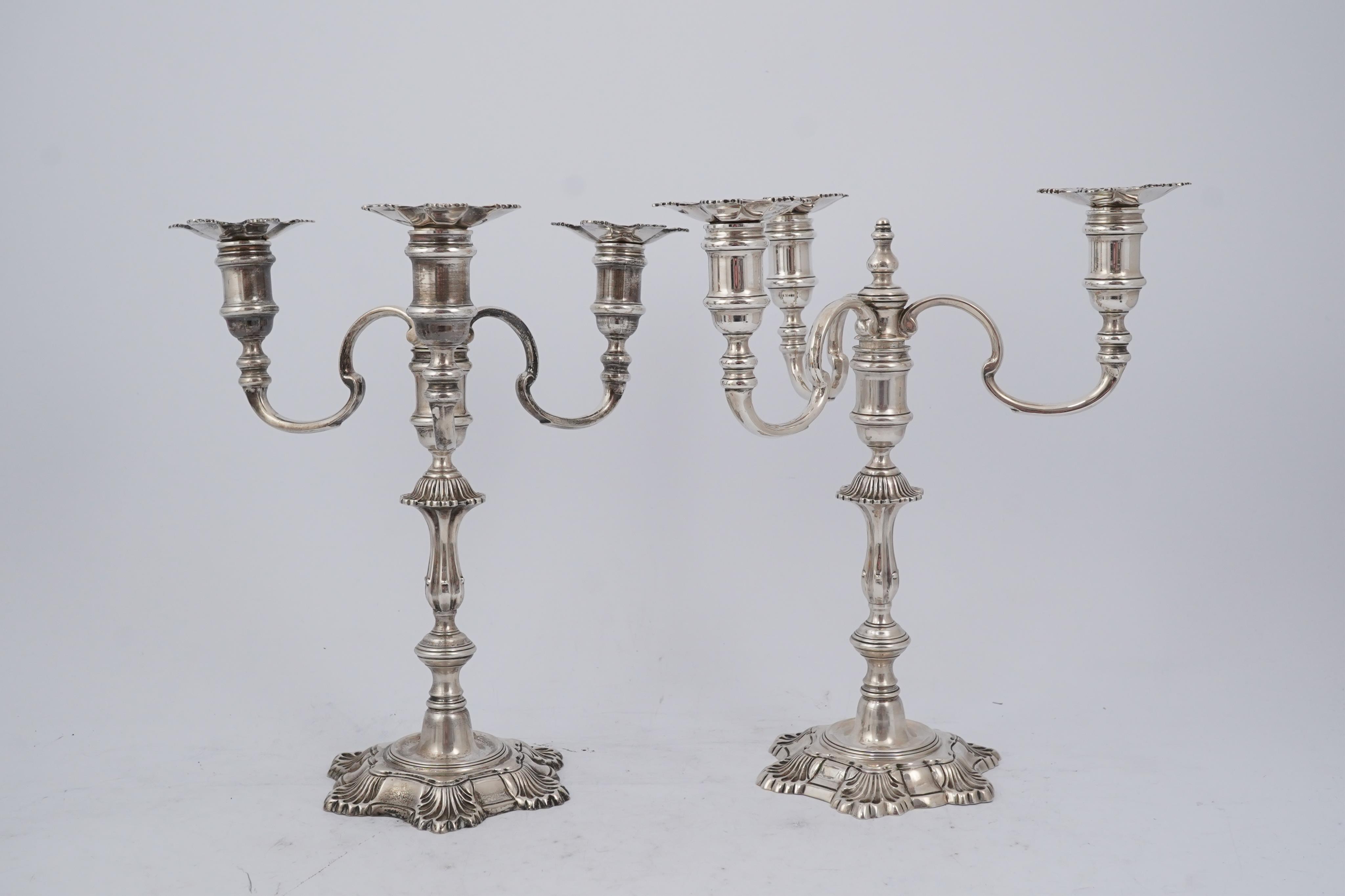 A pair of Elizabeth II cast silver three branch, three light candelabra, by J.B. Chatterley & Sons Ltd